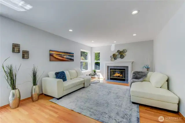 The cozy family room, featuring a gas fire place