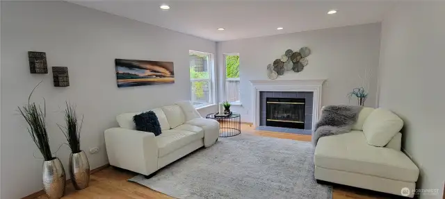 The cozy family room, featuring a gas fire place
