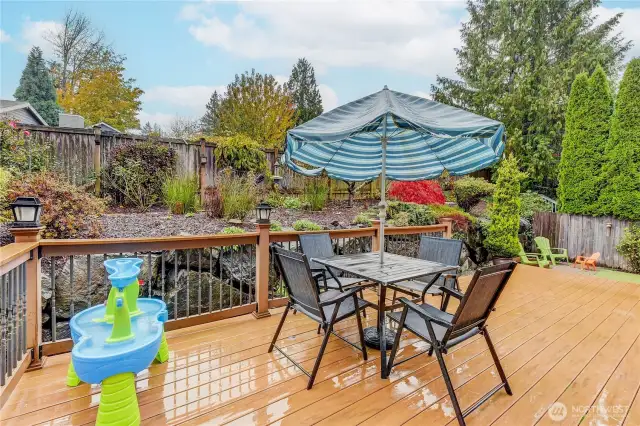 The backyard offers a peaceful outdoor escape, complete with a spacious deck—perfect for barbecues, relaxing in the sun, or entertaining guests in a private, serene setting.
