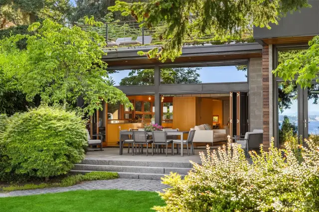 South-facing glass walls bring light and views to every room.