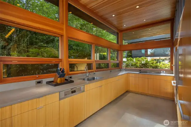 Chef’s kitchen with Caesarstone counters and Miele appliances.