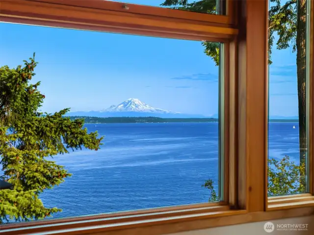 Triple-pane Loewen windows frame mountain and water views.