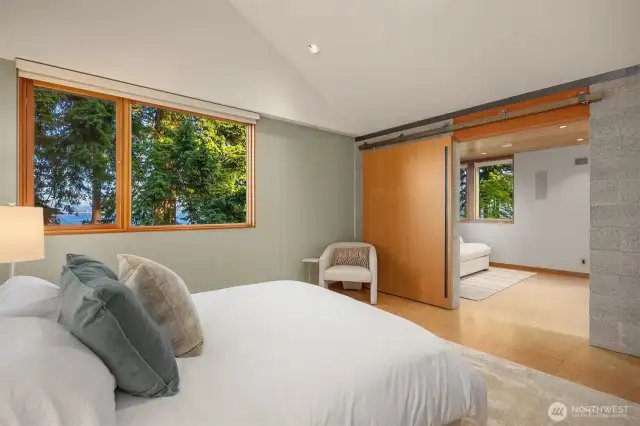 Secondary suite with en suite bath and private sliding doors.