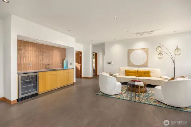 Spacious family room with wet bar and water views