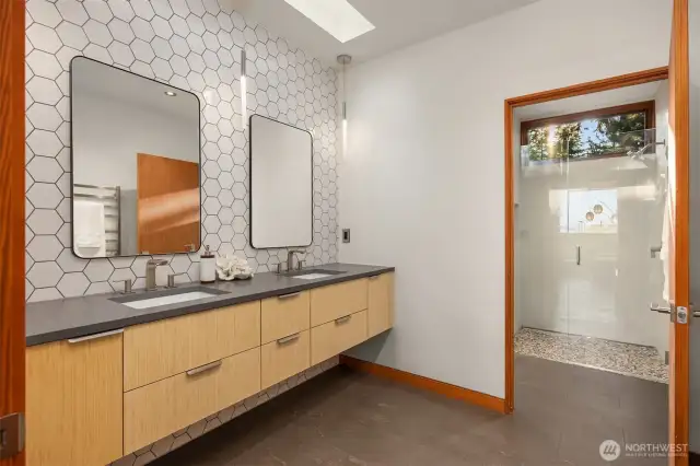 Spa-inspired West Wing bathrooms with sleek fixtures and modern tile