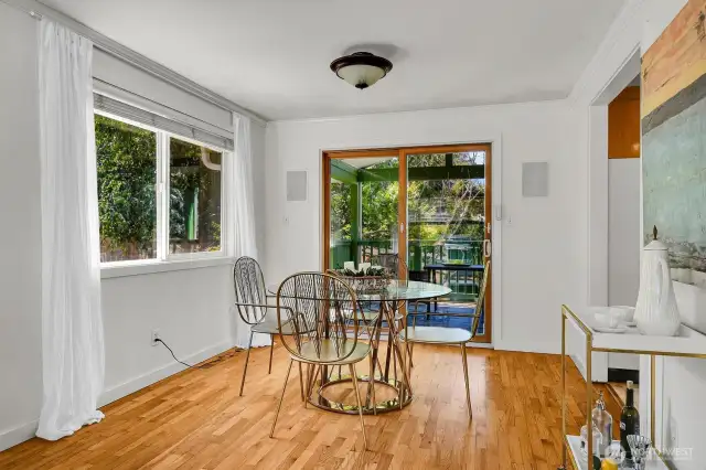 Dining room features sliders to covered deck