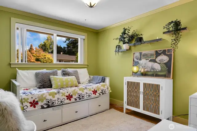 One of three main-floor bedrooms