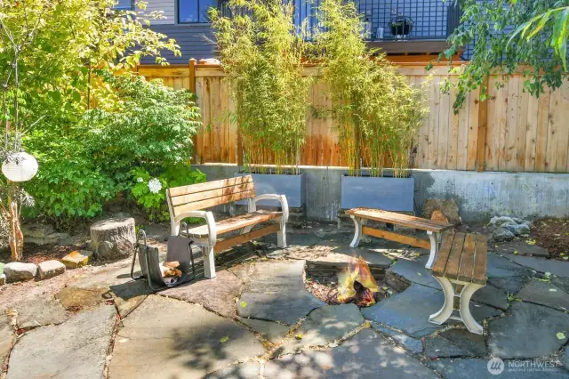 Enjoy the firepit and side yard with bamboo privacy fence