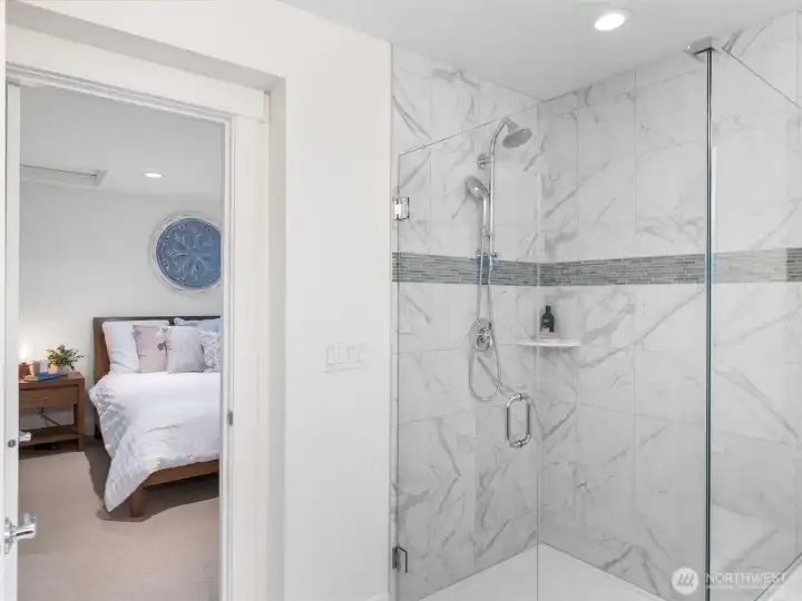 Wonderful walk-in shower with seamless glass surround.