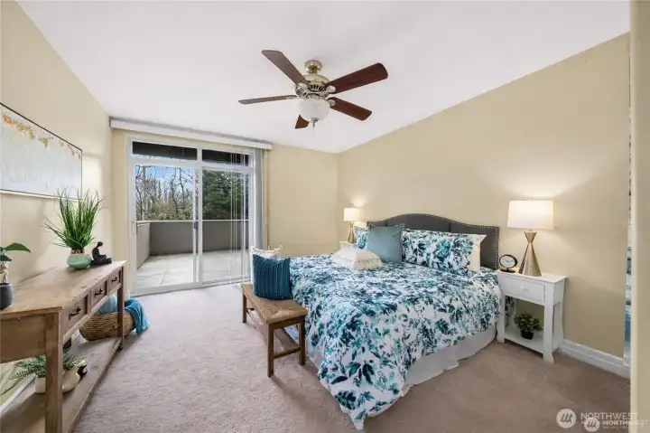 Primary suite featuring an en-suite bathroom, walk in closet and a private balcony