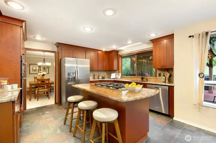 Remodeled kitchen with cherry cabinets and granite counters