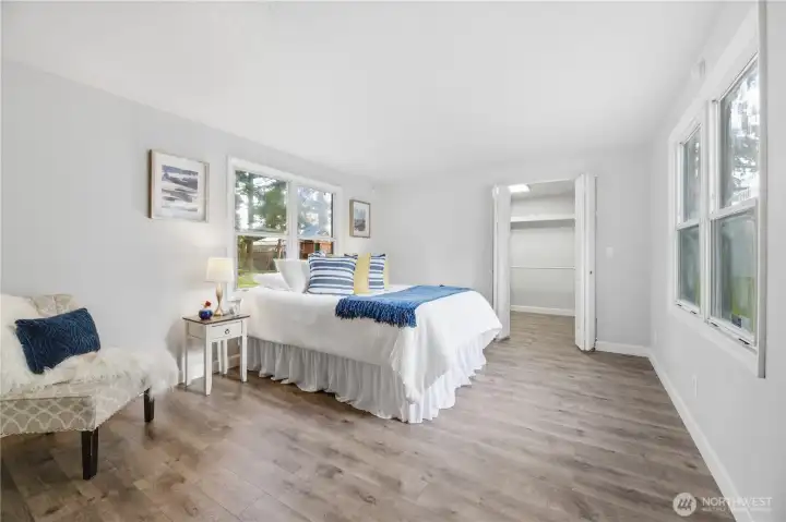 Spacious primary bedroom with walk-in closet and bath