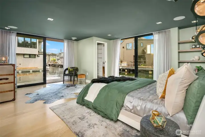 Generous primary suite with two outdoor spaces, two walk-in closets and ensuite bathroom.