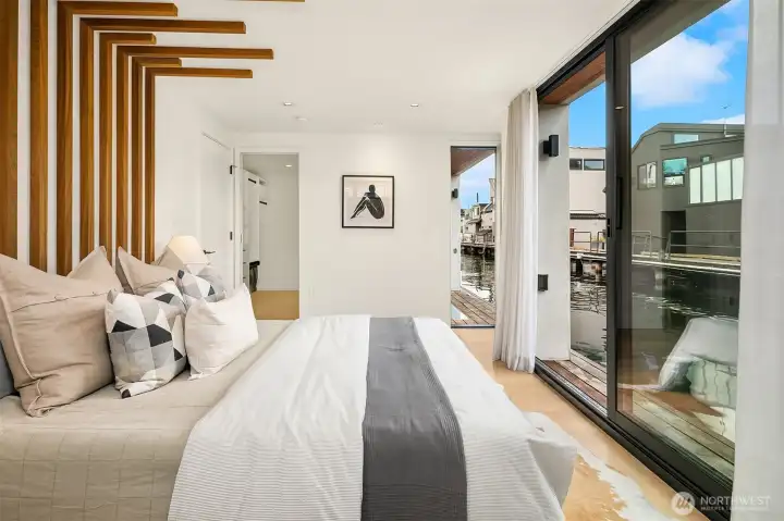 Guest bedroom with outdoor space and covered deck, ensuite bathroom and walk-in closet