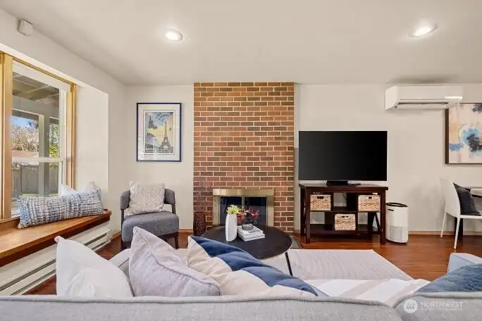 Living room features wood burning fireplace