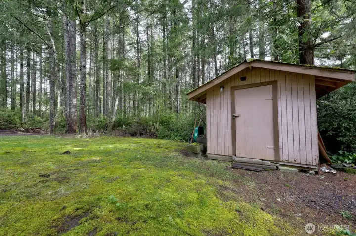 Outbuilding near parking spaces