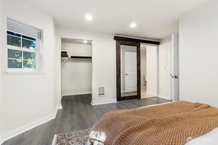 Primary with walk-in closet and en suite bath.