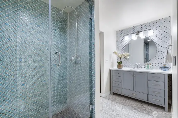En suite bathroom- updated with exquisite tiling.