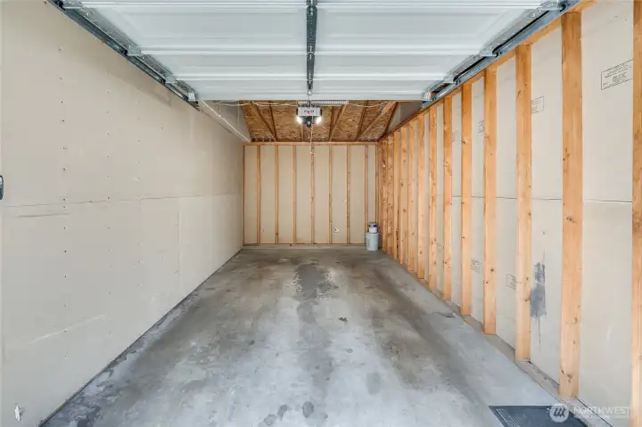 PLENTY of space to put shelving, bike hooks, etc at back of garage for storage.