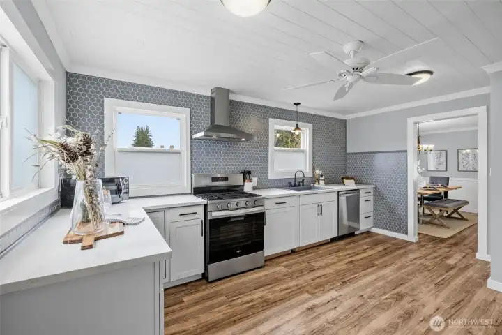 Stylish tile backsplash + stainless steel appliances for a polished finish