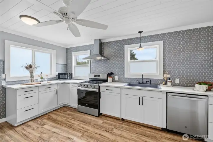 Bright, modern chef’s kitchen with quartz counters & sleek cabinetry