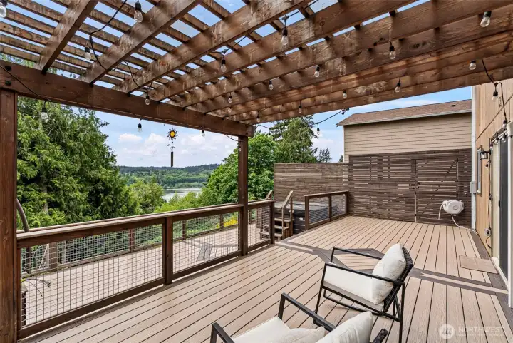 Private oversized 2 level deck with hot tub and views of Sinclair Inlet.