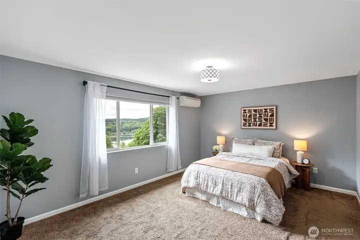 Primary bedroom with water views of Sinclair Inlet
