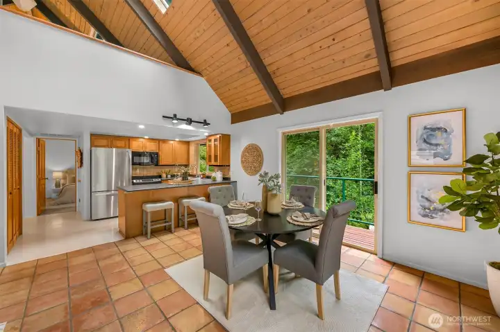 Dining area positioned beside the deck for seamless indoor-outdoor living, surrounded by peaceful forest views. Dining area positioned beside the deck for seamless indoor-outdoor living, surrounded by peaceful forest views.