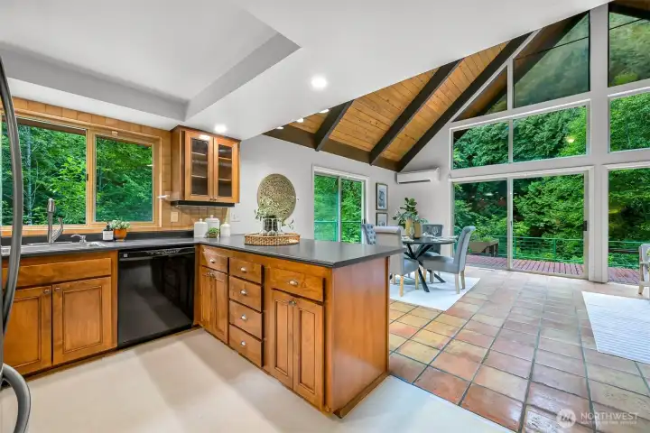 Open kitchen design keeps the cook connected to both the dining area and great room while enjoying views of the surrounding landscape. Open kitchen design keeps the cook connected to both the dining area and great room while enjoying views of the surrounding landscape.