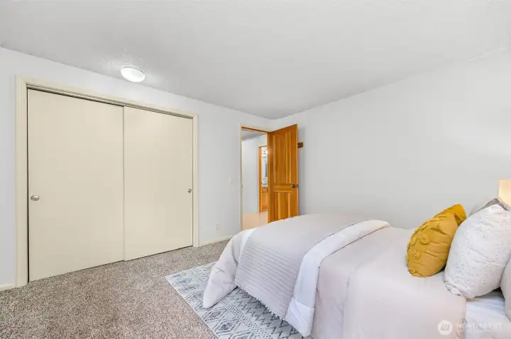 The primary bedroom provides ample closet space and a peaceful retreat tucked among the trees. The primary bedroom provides ample closet space and a peaceful retreat tucked among the trees.
