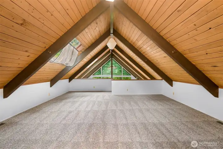 Expansive loft with vaulted architecture creates endless possibilities for work, play, or relaxation while overlooking the home's signature great room. Expansive loft with vaulted architecture creates endless possibilities for work, play, or relaxation while overlooking the home's signature great room.