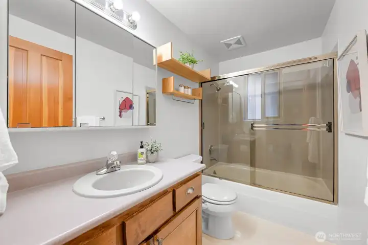 Convenient full guest bathroom featuring an oversized vanity and tub/shower combination. Convenient full guest bathroom featuring an oversized vanity and tub/shower combination.
