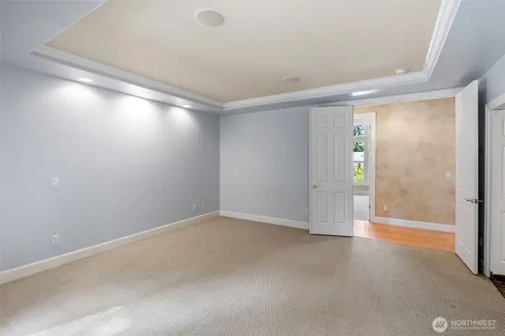 Primary Bedroom with custom lights and coffered ceilings Primary Bedroom with custom lights and coffered ceilings