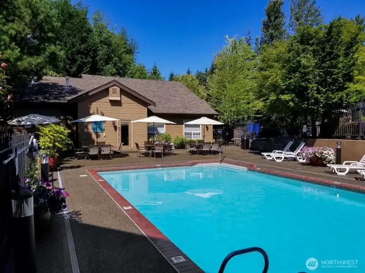 Community outdoor pool and clubhouse amenities.