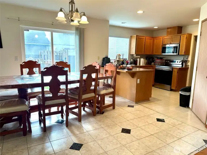 Bright open space with sliding door access to a beautiful backyard. Bright open space with sliding door access to a beautiful backyard.