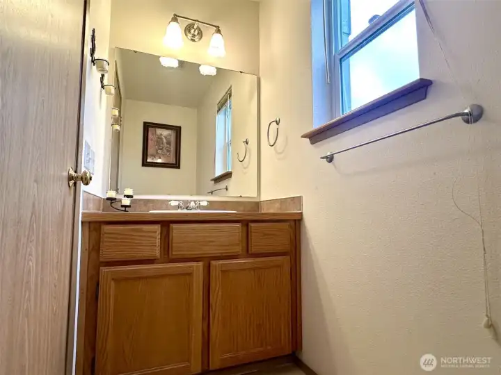 Convenient guest half bath on main level Convenient guest half bath on main level