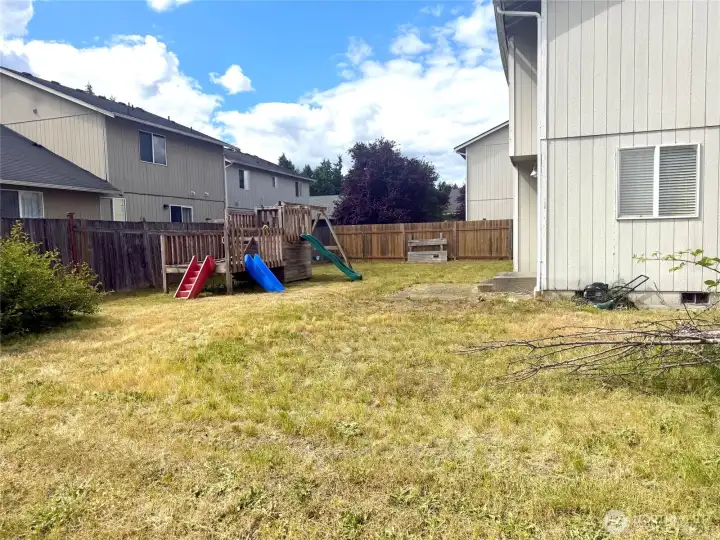 The backyard includes a small kids play area. The backyard includes a small kids play area.