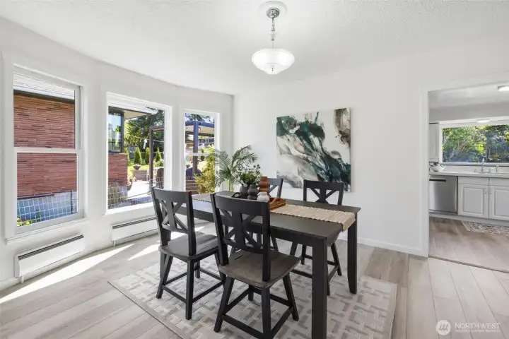 Spacious dining area with a seamless flow into the kitchen, perfect for entertaining and gatherings.