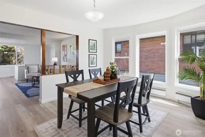 Bright and airy living space featuring abundant natural light streaming through oversized windows.