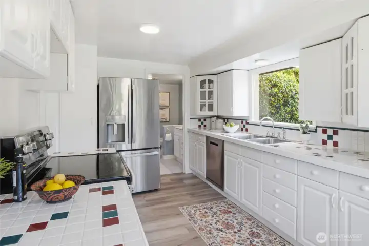 Charming eat-in kitchen featuring ample counter space, perfect for all your meal preparation needs.