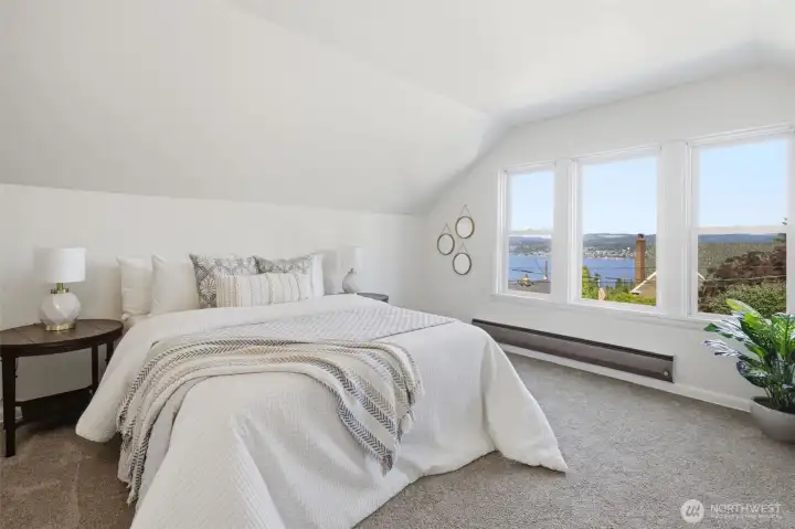 Experience the serenity of waking up to this Lakee Washington view every day. Located on the second floor, the primary bedroom offers a peaceful and tranquil retreat. This level of has big potential to be recreated into a primary suite in the future.