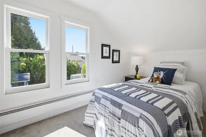Second bedroom located on the upper level. This versatile space is perfect as a child's bedroom, home office, or private workout room—make it your own!