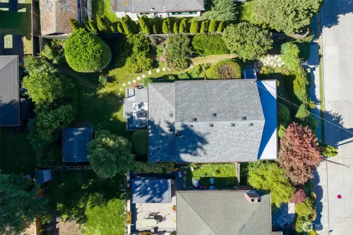 Overhead image of the property shows the mature landscaping and newer roof.