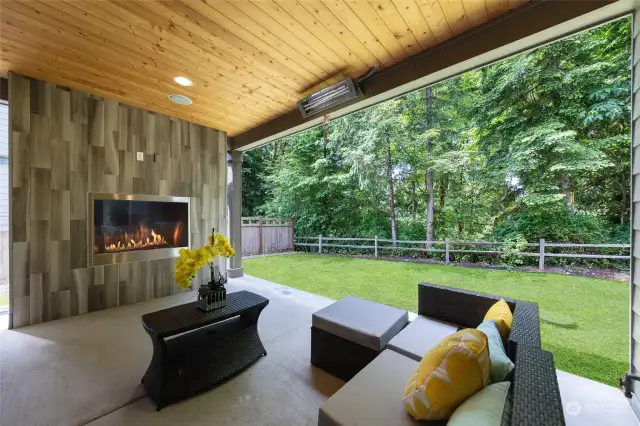 Covered patio with gas fireplace.
