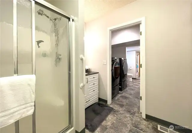 Utility room is located between the two living areas for convenience.