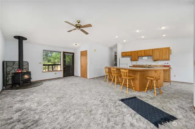 Nice open floor plan with the living room, kitchen and dining area all open to one another and a cozy wood burning stove.