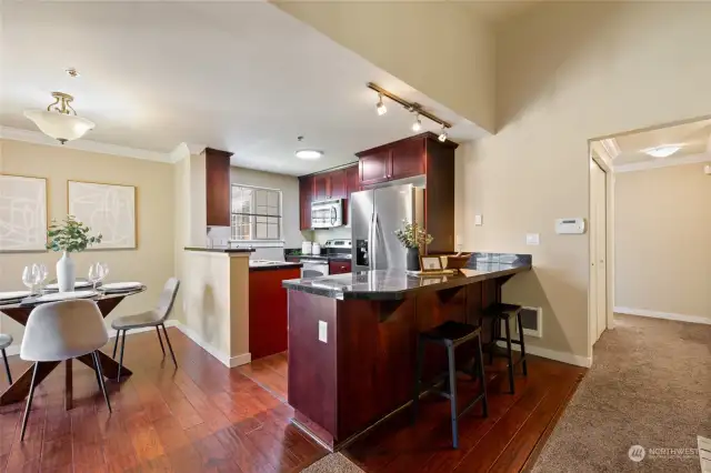 Dining area and the kitchen with plenty of cabinet for your kitchen gadgets.