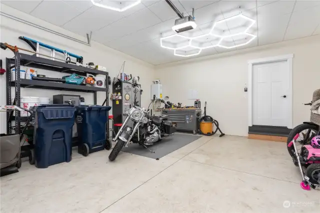 The garage has a custom ceiling and lighting installed.