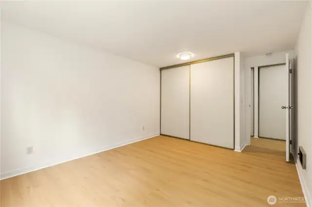 Another view of bedroom 2 with large closets new flooring and paint also