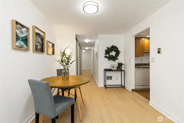 Second view of dining area looking down hallway and into kitchen just off family room.  Its very light and bright at this condo